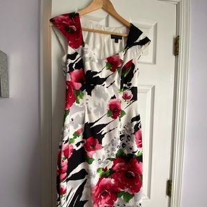 Evening or work dress. Falls above knee.